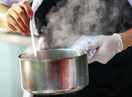 chef cooking, Chef preparing food, Chef decorating dish in the kitchen photo