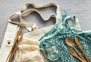 Mesh bag, cotton bags and glass jars photo