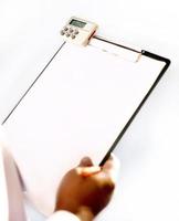 Hand writing on blank paper of black plastic clipboard photo