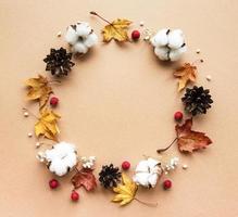 Autumn decoration with cotton flowers and dry leaves photo