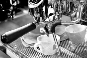 espresso shot from coffee machine in coffee shop photo