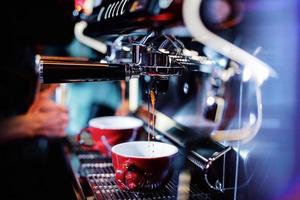 espresso shot from coffee machine in coffee shop