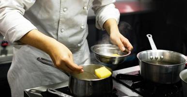 Chef preparing food, meal, in the kitchen, chef cooking photo