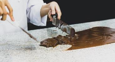 Chocolate fudge frosting, making chocolate fudge photo