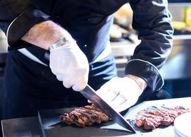 Chef preparing food, meal, in the kitchen, chef cooking photo