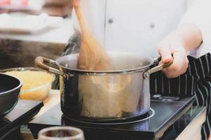 Chef preparing food, meal, in the kitchen, chef cooking photo