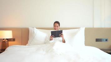 Young Asian woman reading a book video