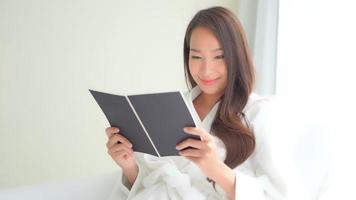 Young Asian woman reading a book video