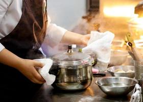 Chef preparing food, meal, in the kitchen, chef cooking photo