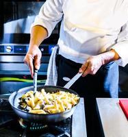 Chef preparing food in the kitchen, chef cooking, closeup photo