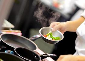 Chef preparing food, meal, in the kitchen, chef cooking photo