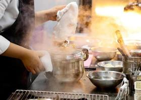 Chef preparing food, meal, in the kitchen, chef cooking photo