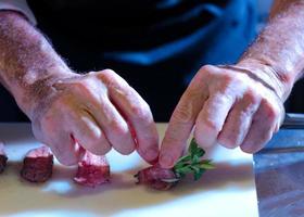 Chef preparing food in the kitchen, chef cooking, Chef decorating dish photo