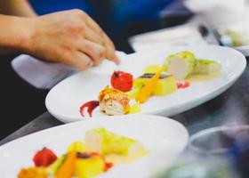 Chef preparing food in the kitchen, chef cooking, Chef decorating dish photo