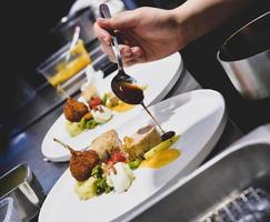 Chef preparing food in the kitchen, chef cooking, Chef decorating dish photo