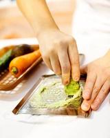 Sushi chef grating fresh Wasabi, Fresh wasabi root photo