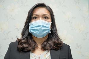 Asian lady wearing mask new normal in office