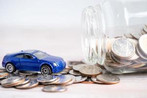 Car on coins background Car loan photo