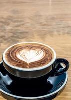 Black Coffee cup on wood table photo