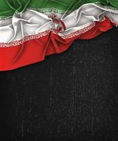 Iran Flag Vintage on a Grunge Black Chalkboard With Space For Text photo