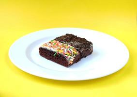 Sponge cake on white plate isolated photo