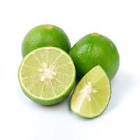 Lime with slices isolated on a white background photo