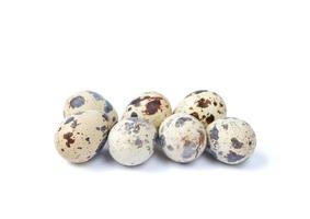Quail eggs isolated on a white background photo