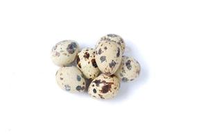 Quail eggs isolated on a white background photo