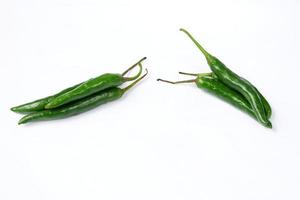 Green chili isolated on a white background photo