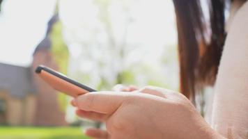 Close up woman hand using smartphone video