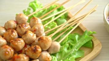 grilled meatball skewer with spicy sauce
