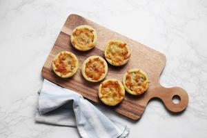 Mini pie from meat and mushrooms in metal tray photo
