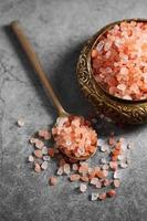 Himalayan pink salt in golden spoon at loft kitchen photo