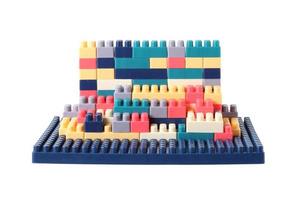 Small plastic building blocks on white background photo