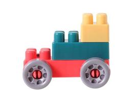 Small train from plastic blocks on white background photo