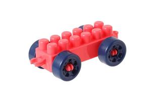 Small train from plastic blocks on white background photo