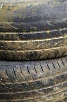 Close up old and dirty tire in sun light photo