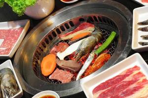 Close up cooking Japanese barbecue in restaurant photo