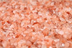 Close up a pile of Himalayan pink salt in natural light photo