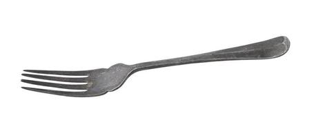 Vintage metal fork on white background photo
