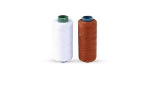 Color sewing thread isolated on a white background photo