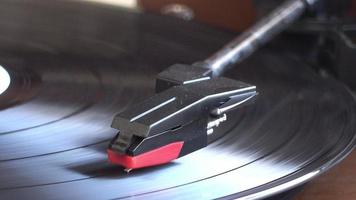 Turntable player spinning to playing video