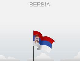 Flag of Serbia flying under the white sky vector