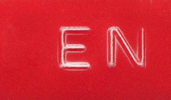 EN English language label made with red embossing tape photo