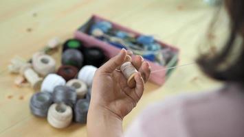 Embroider sewing by woman hand. Craft work and female hands. photo