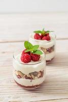 Fresh raspberry and yogurt with granola photo
