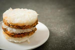 Grilled spicy pork and herbs with  sticky rice burger photo