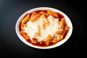 Korean rice cake in spicy Korean sauce with cheese photo