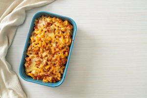 Homemade macaroni bolognese with cheese photo