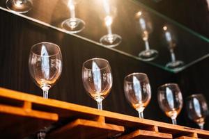Drinking wine glasses shelf in restaurant with lighting showcase photo